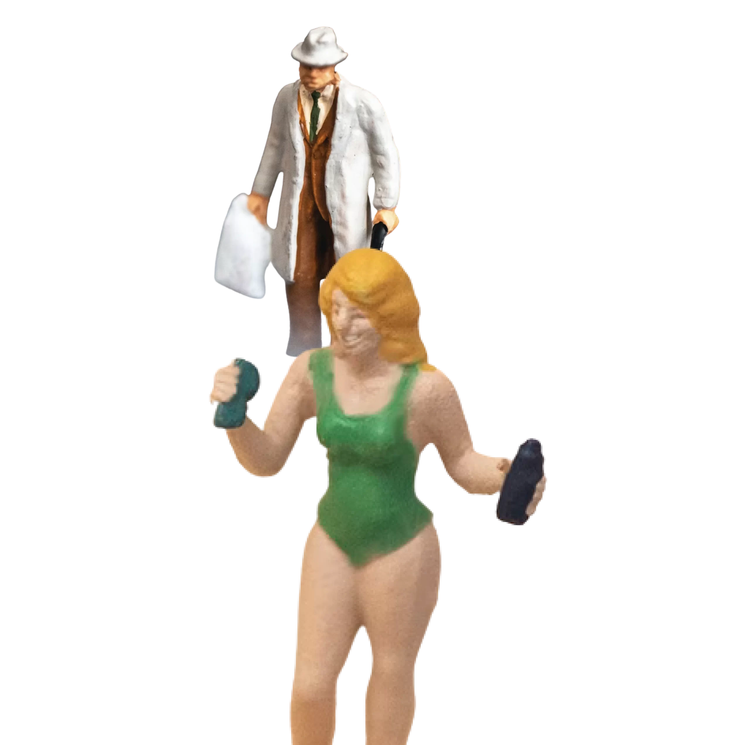 A tiny figurine of a man in a trench coat appears to be looking down at a larger figurine of a woman in a green swimsuit who is in a running pose.