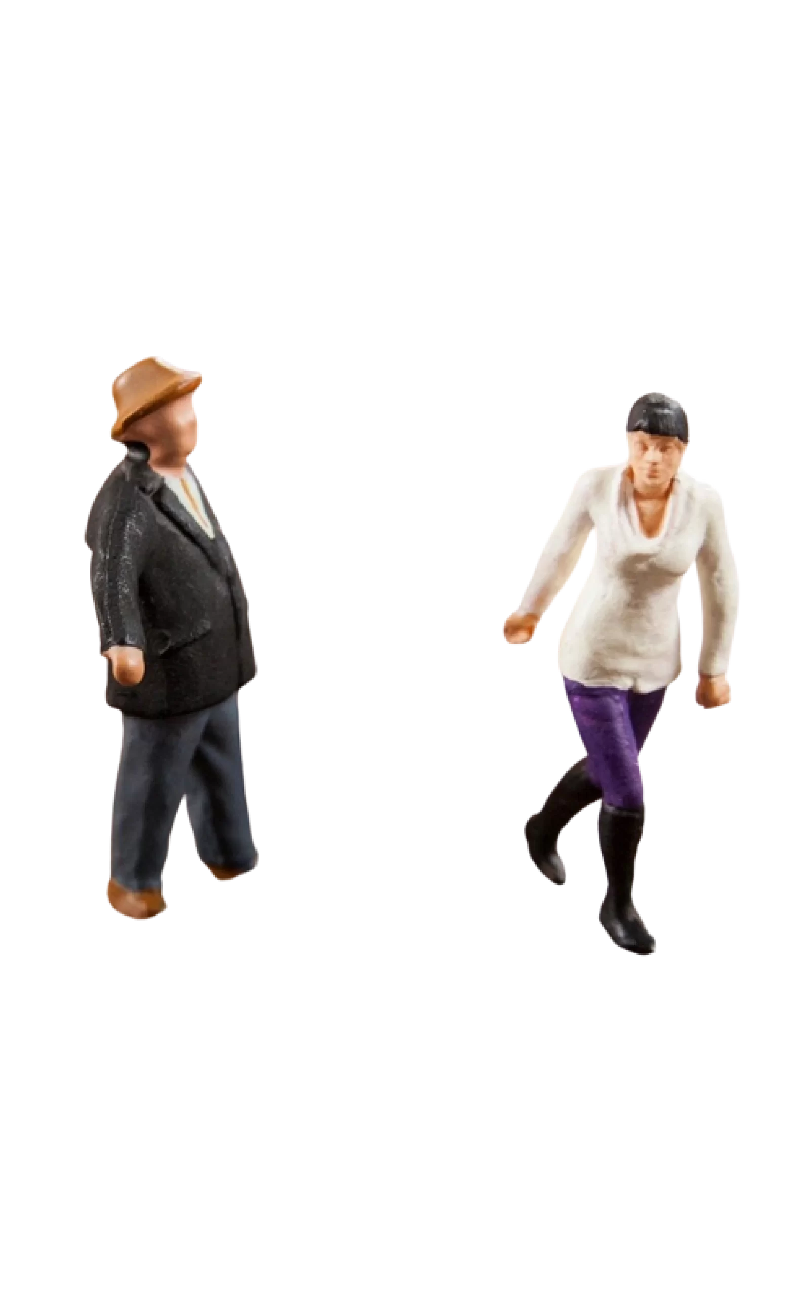 Two miniature figures depicting men, one walking and the other seemingly in a running pose, isolated on a black background.